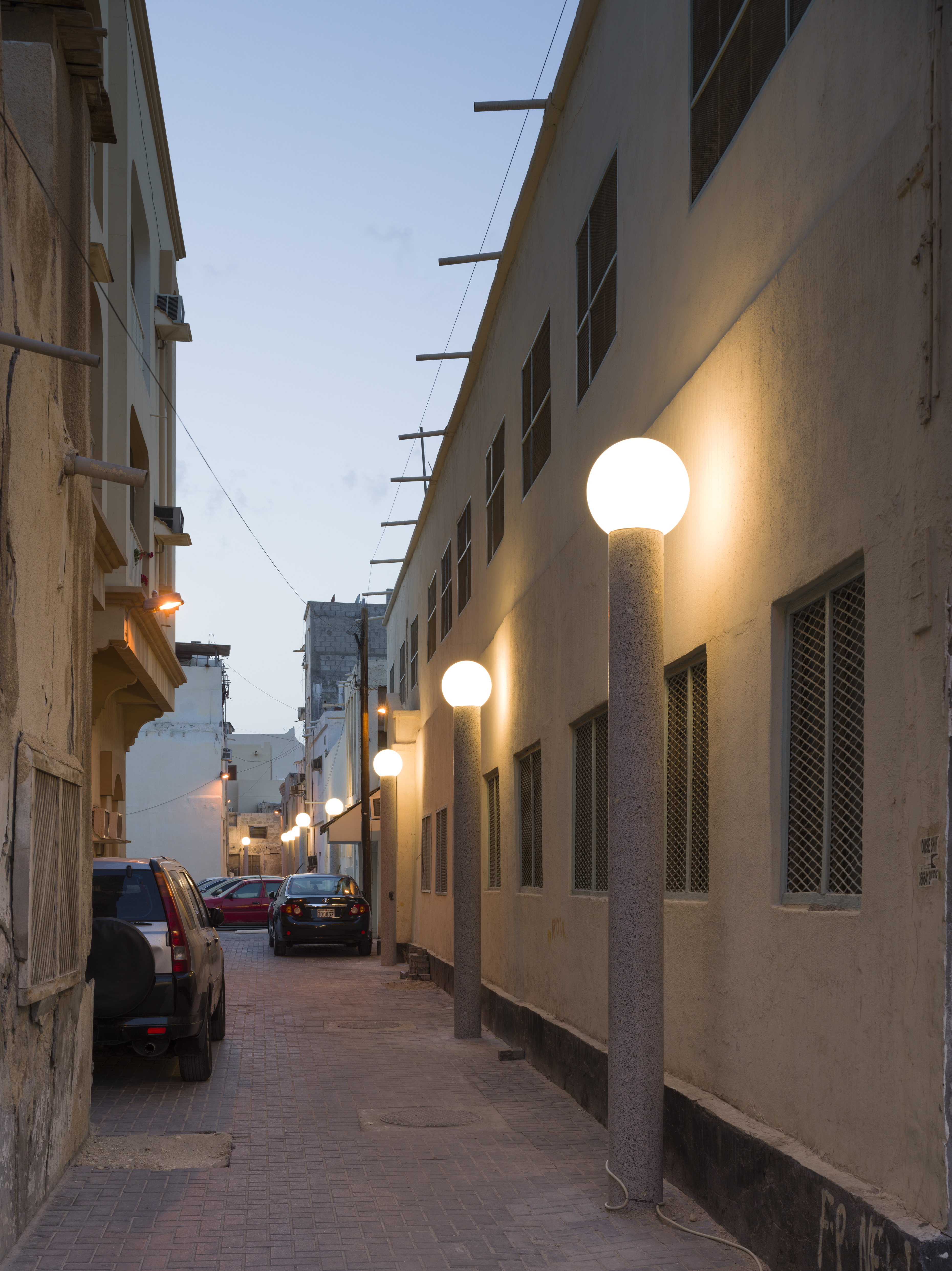 Lighted street at dusk.
