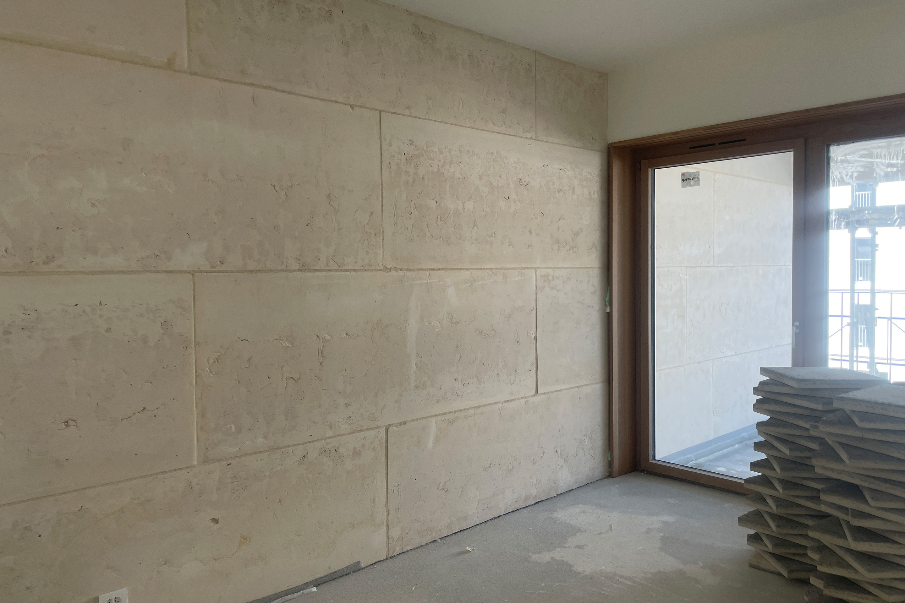 Cantiere per gli immobili in pietra massiccia a Plan-les-Ouates, progettati dal consorzio Perraudin Archiplein