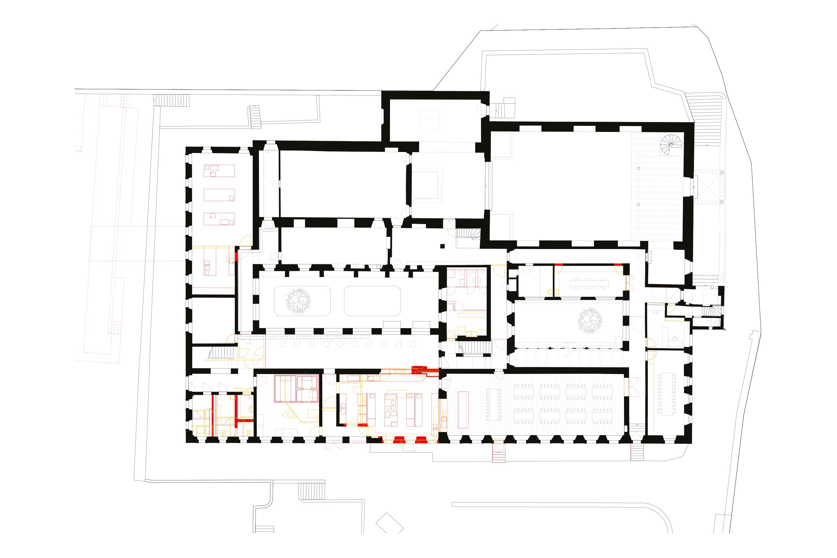 Le restaurant se situe dans un angle du bâtiment (en bas à droite). La cuisine à gauche témoigne de la nouvelle fonction du bâtiment; l’église baroque, en haut, de son ancien usage.