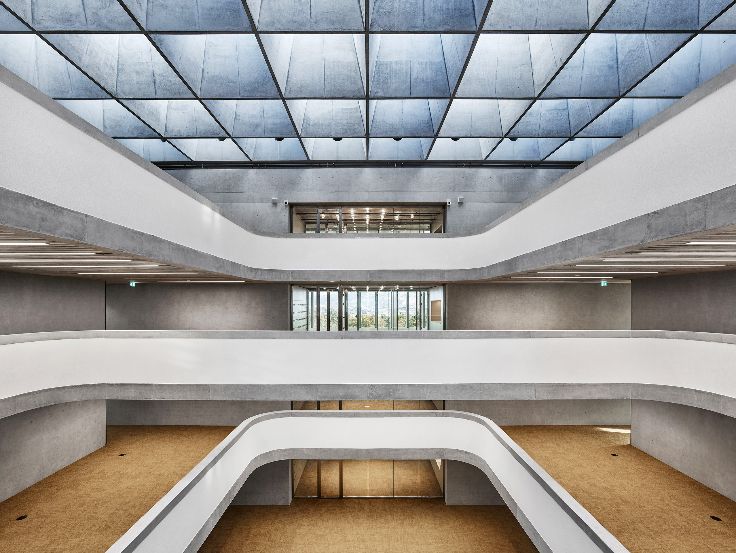 WHO Headquarter Geneva 2020 Berrel Berrel Kräutler Architekten Engineering Dr. Schwartz Consulting &amp; Dr. Neven Kostic  View of the central hall