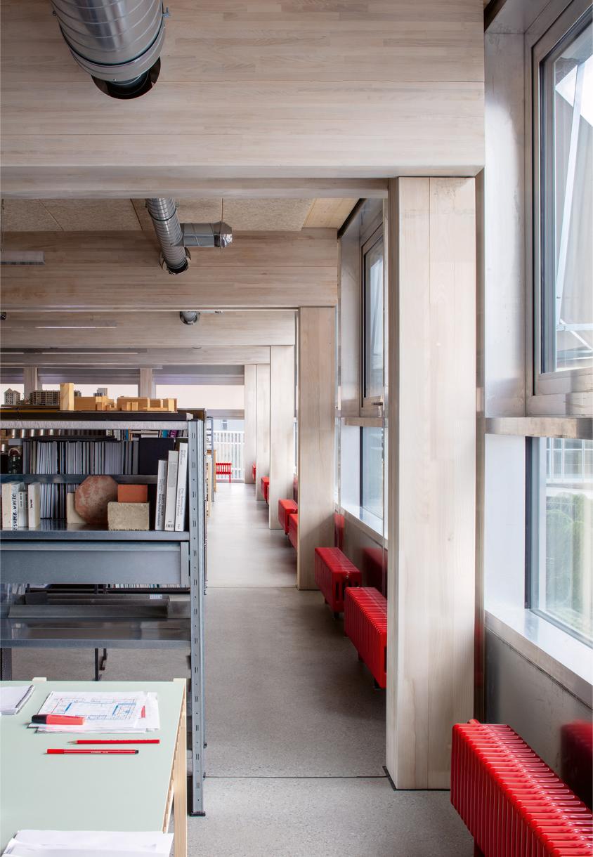 Exposed timber structure and technical systems on the large open floor plates.