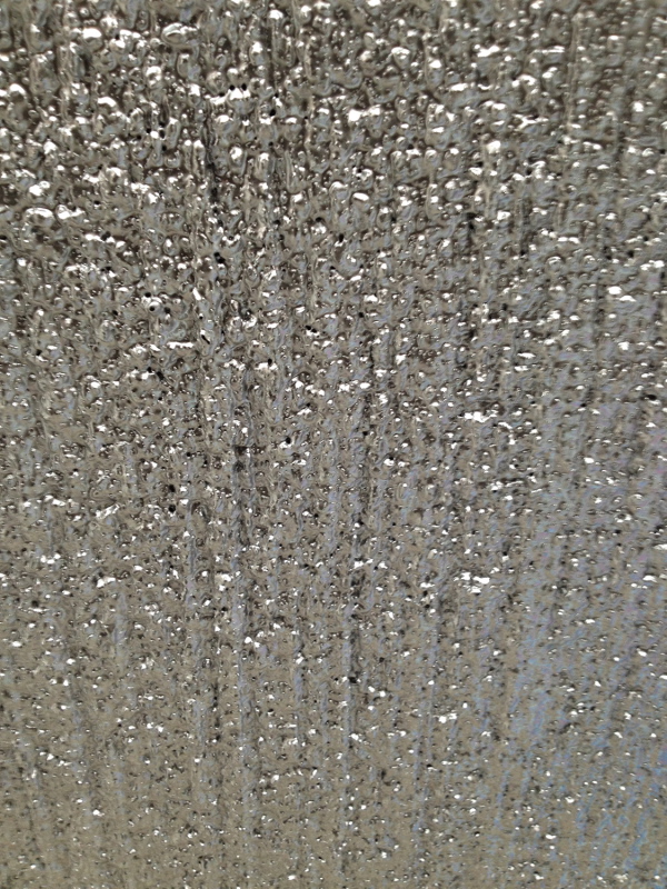 Nahaufnahme einer lackierten Fläche.