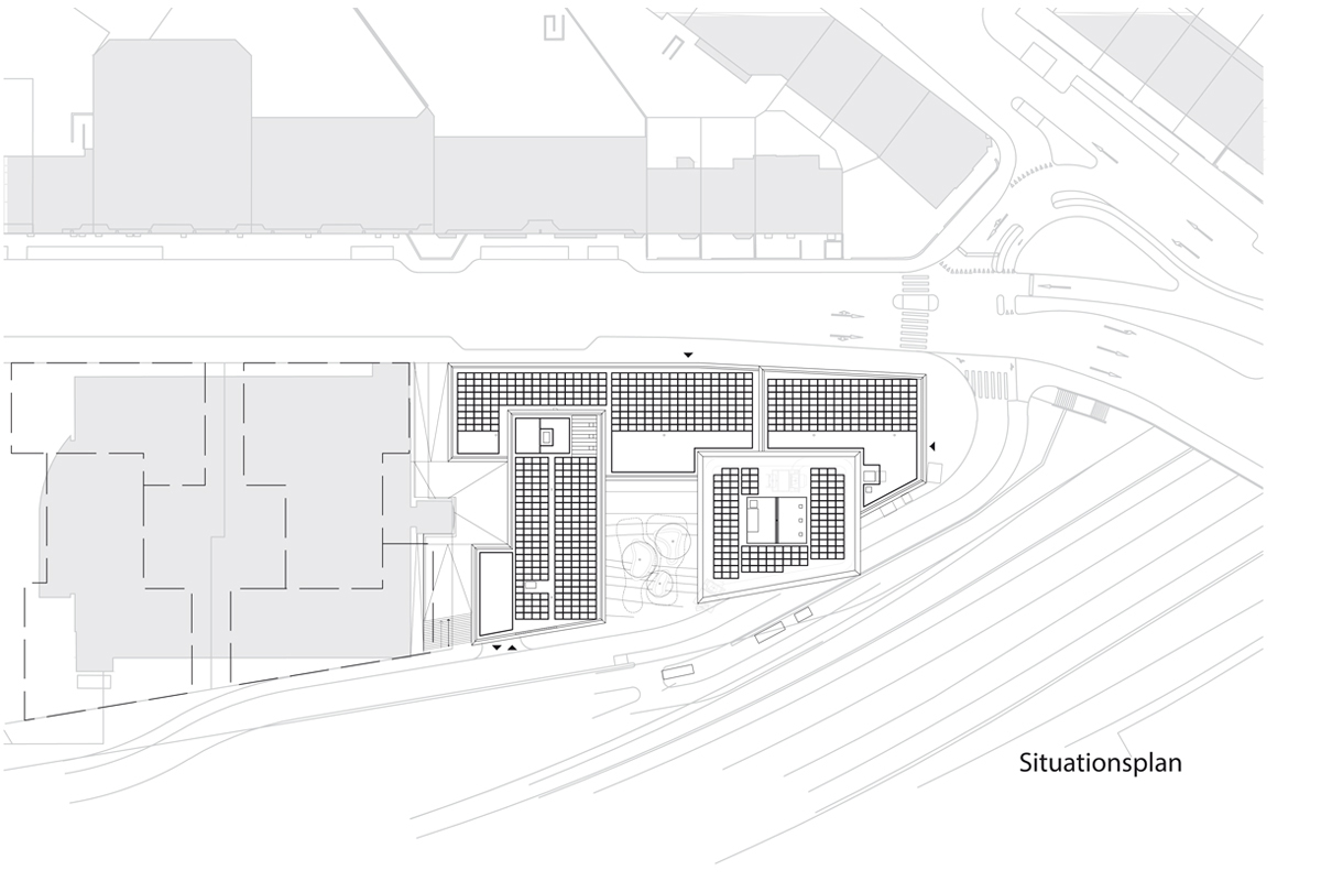 Situation neben den Gleisen der SBB: Im trapezförmigen Grundstück greifen Sockel und Turm des Neubaus ineinander. Die südöstliche Ecke des Turms kragt oberhalb des 1. OG um rund 9 m über der Erschliessungsstrasse aus.