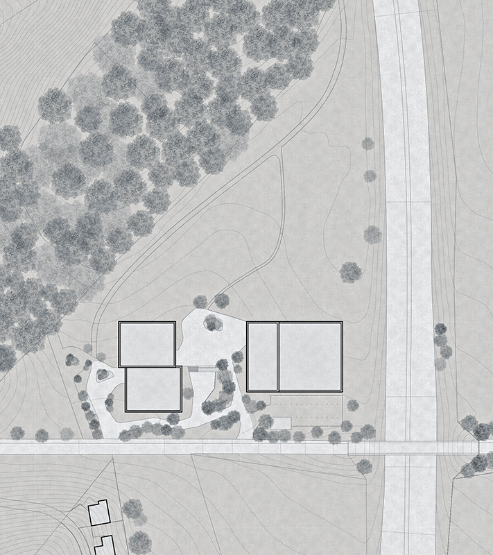 Situation,. Die Primarschule (links) und die Doppelturnhalle (rechts) bilden das Schulzentrum Chavully zwischen einem Wäldchen und der Autobahn A12.