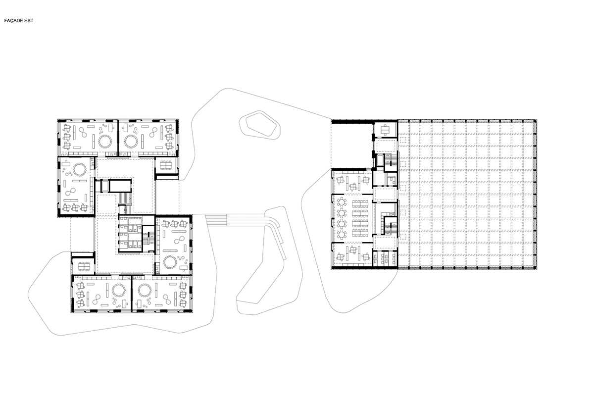 Grundriss EG, Mst. 1 : 750. In der auch ausserhalb der Schulzeiten zugänglichen Doppelturnhalle (rechts) sind neben der dazugehö­rigen Infrastruktur auch die Räume für Logopädie, Rhythmik und Tagesbetreuung sowie zwei Abwartswohnungen untergebracht.
