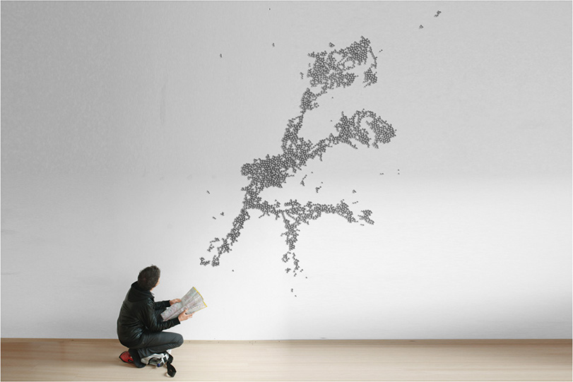 BlingCrete?/?Magnetic positioning of concrete Studie für ein Leitsystem (2010). Ungeordnete Verteilung von Stahlkugeln auf einer Betonwand ohne gerichtetes Magnetfeld. (Computersimulation: T. Klooster, H. Klussmann, C. Winkler)